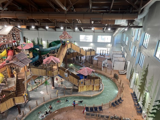 Indoor waterpark with slides, a lazy river, and various play structures at Great Wolf Lodge Northern...