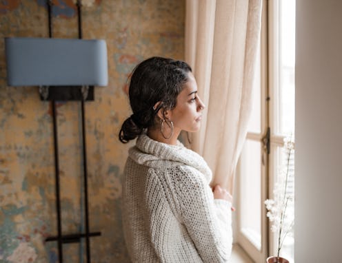 sad woman at the window