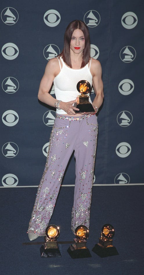 Singer Madonna with her Grammy awards in 1999