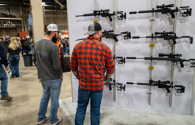 HARRISBURG, PENNSYLVANIA - FEBRUARY 09: People look at guns and ammunition at the Great American Out...