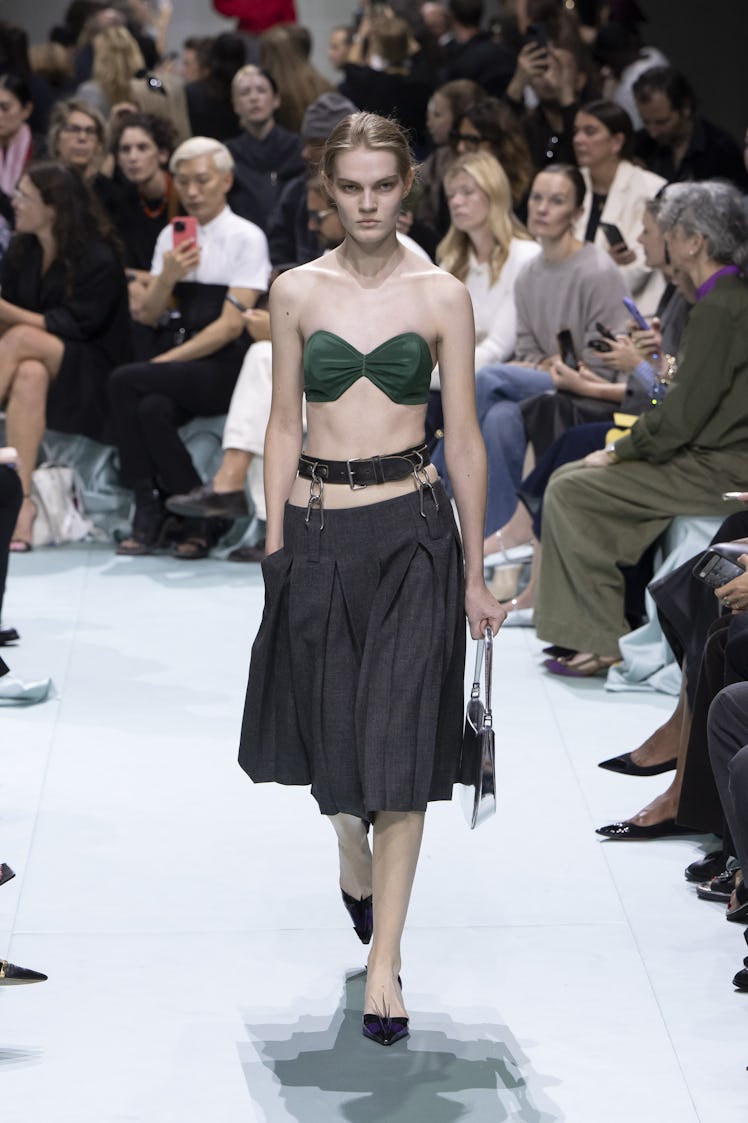 MILAN, ITALY - SEPTEMBER 19: A model walks the runway during the Prada Ready to Wear Spring Summer 2...