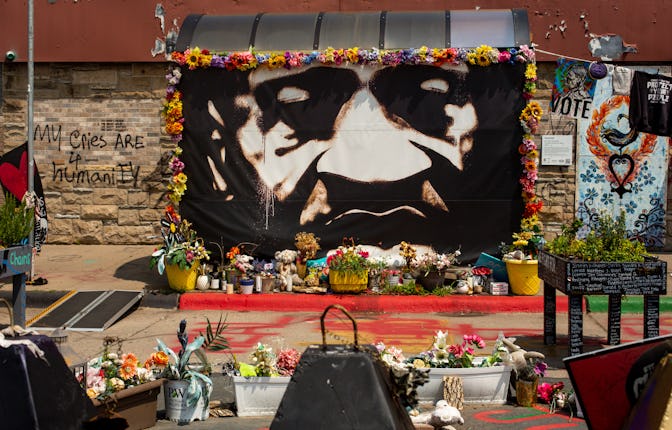 A copy of the mural originally painted by Peyton Scott Russell stands at George Floyd Square Friday,...