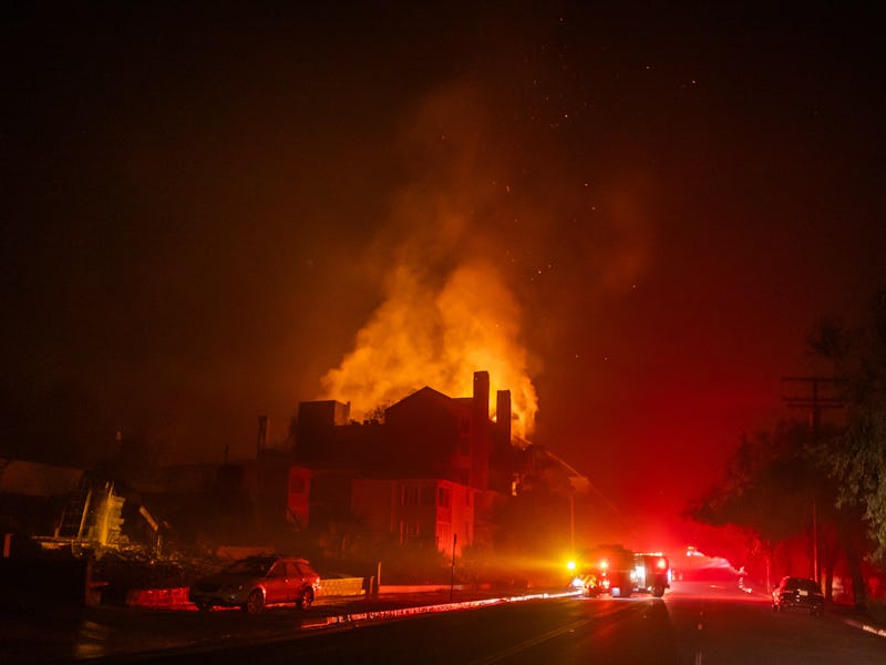 LOS ANGELES, CALIFORNIA - JANUARY 9: Flames from the Palisades Fire burn a residential building on S...