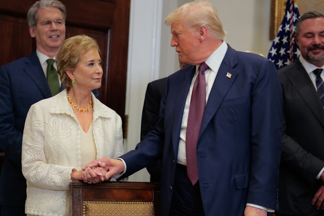 U.S. President Donald Trump speaks with Secretary of Education Linda McMahon during an executive ord...