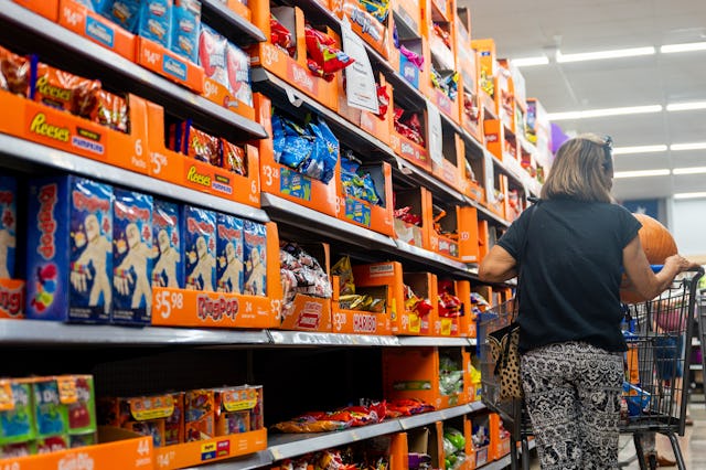 AUSTIN, TEXAS - OCTOBER 16: A customer shops for Halloween candy at a Walmart Supercenter on October...