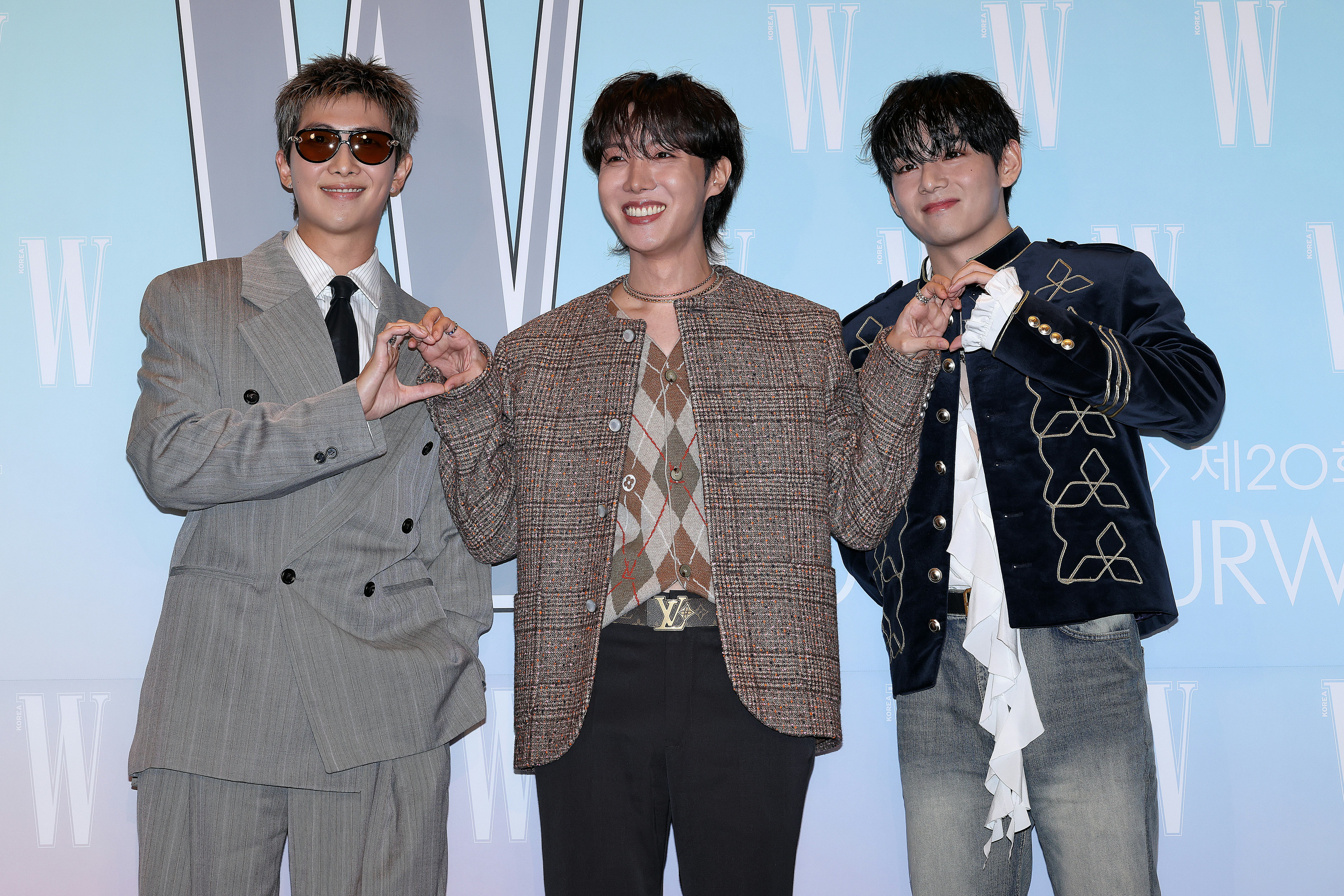 RM, J-Hope and Kim Tae-Hyung aka V of boy band BTS are seen at the 20th W Magazine Korea Breast Canc...