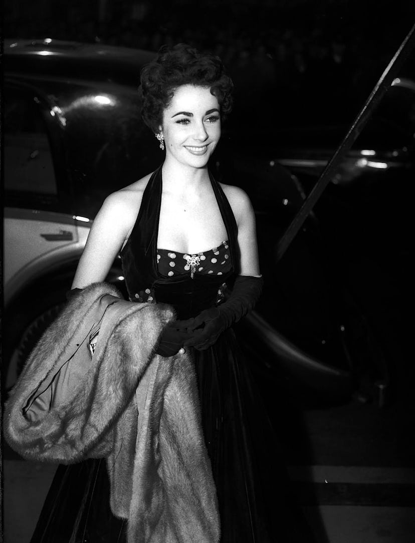 Elizabeth Taylor attends the premiere of The Lady with the Lamp at the Warner Theatre in London. 22n...