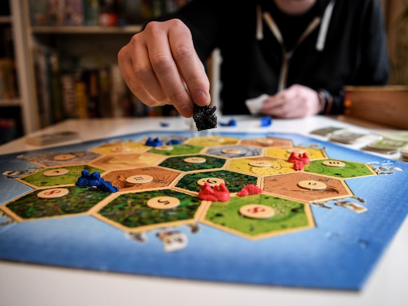 30 April 2020, Berlin: Tim Overkamp shows the game "Settlers of Catan" in the Ludothek "Spielwiese"....