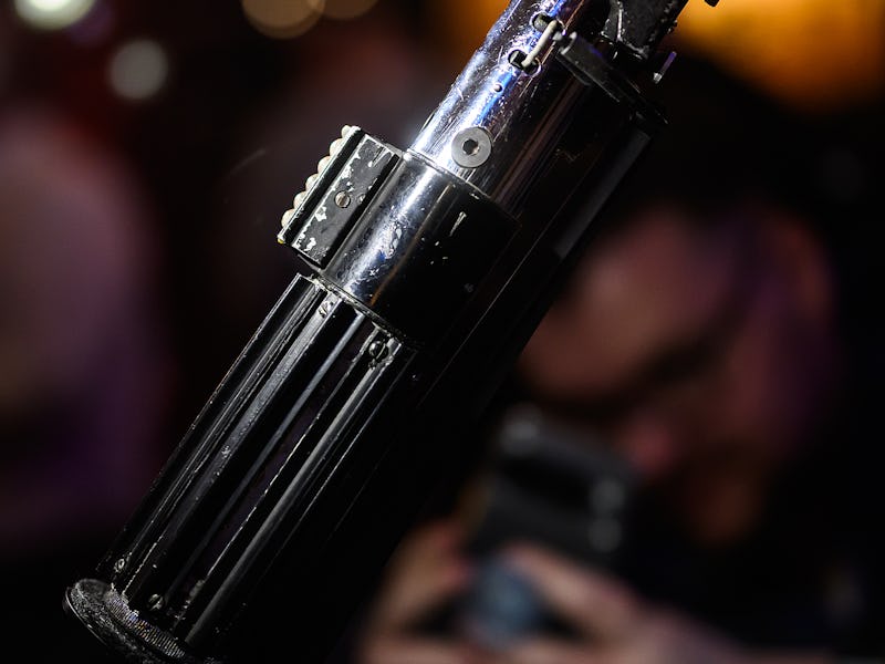 LONDON, ENGLAND - AUGUST 06: The screen-matched lightsaber prop, used by the character "Darth Vader"...