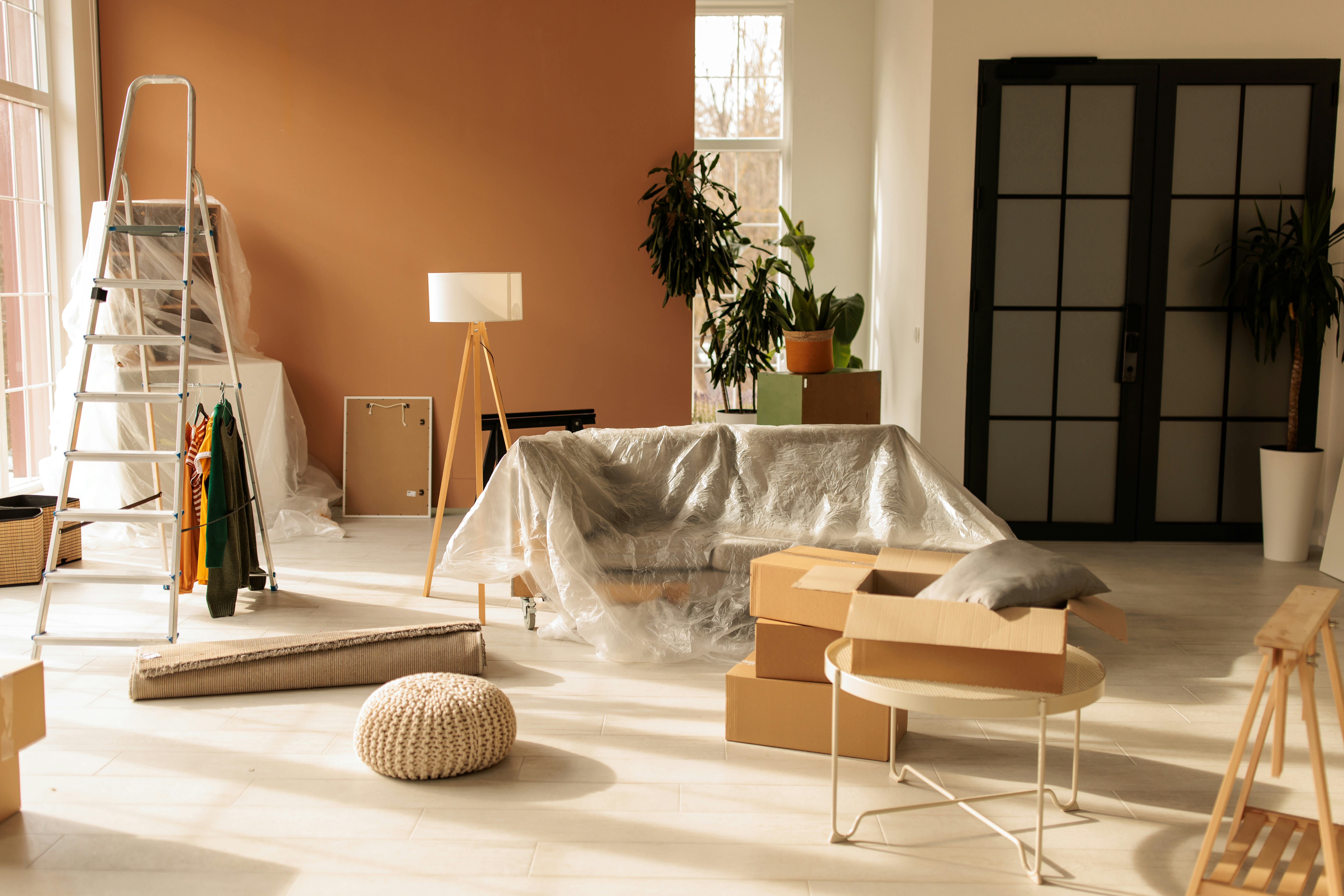 Modern home filled with cardboard boxes and personal items, illustrating the unpacking stage of movi...