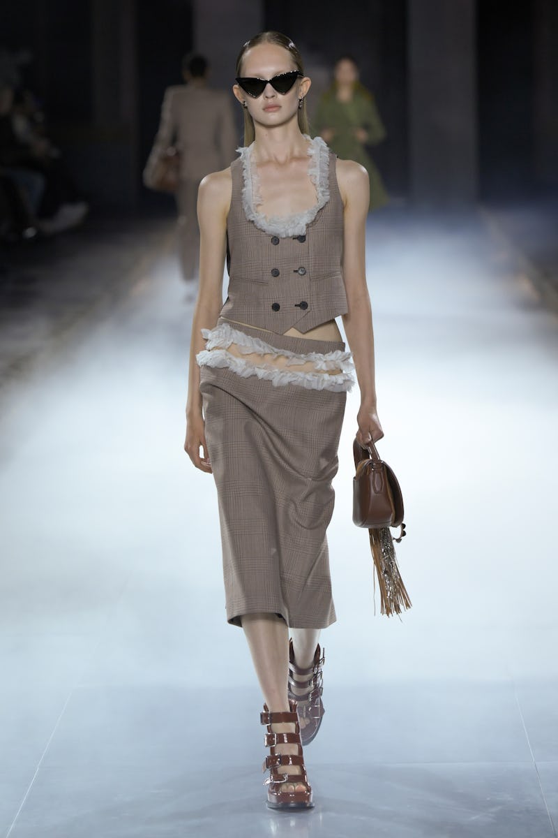 Model on the runway at Alexander McQueen RTW Spring 2025 as part of Paris Ready to Wear Fashion Week...