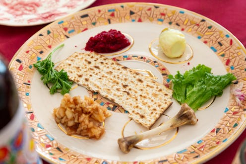 A Passover Seder plate with Charoset, Maror or Bitter Herbs, Karpas, Zeroah or Lamb Shank, Beitza o...