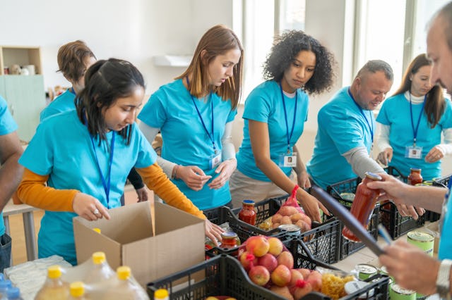 Volunteers sorting and packing food donations at a community center