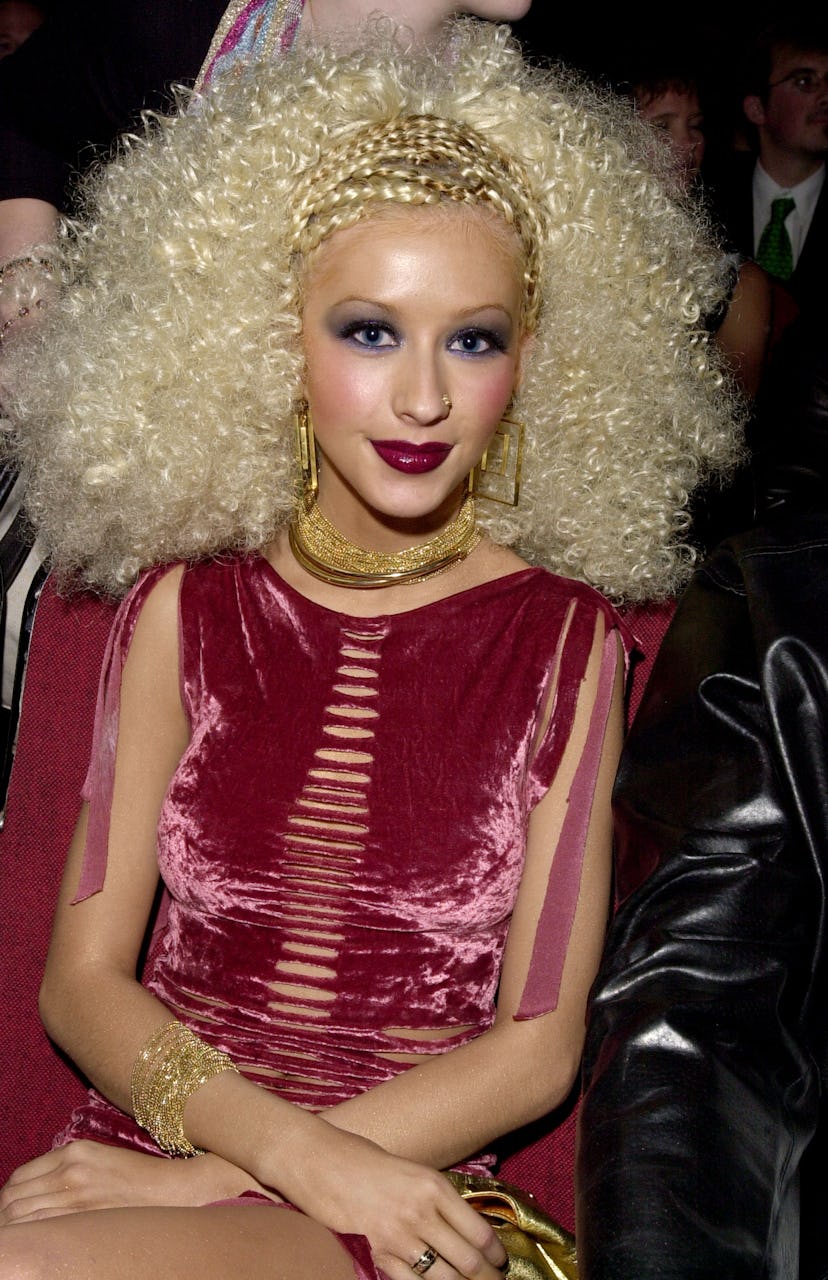 Christina Aguilera wore a ripped, velvet dress to the 2001 Blockbuster Entertainment Awards red carp...