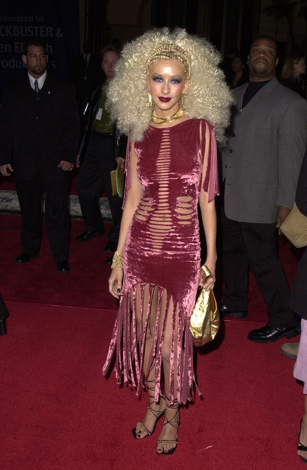 Christina Aguilera wore a ripped, velvet dress to the 2001 Blockbuster Entertainment Awards red carp...