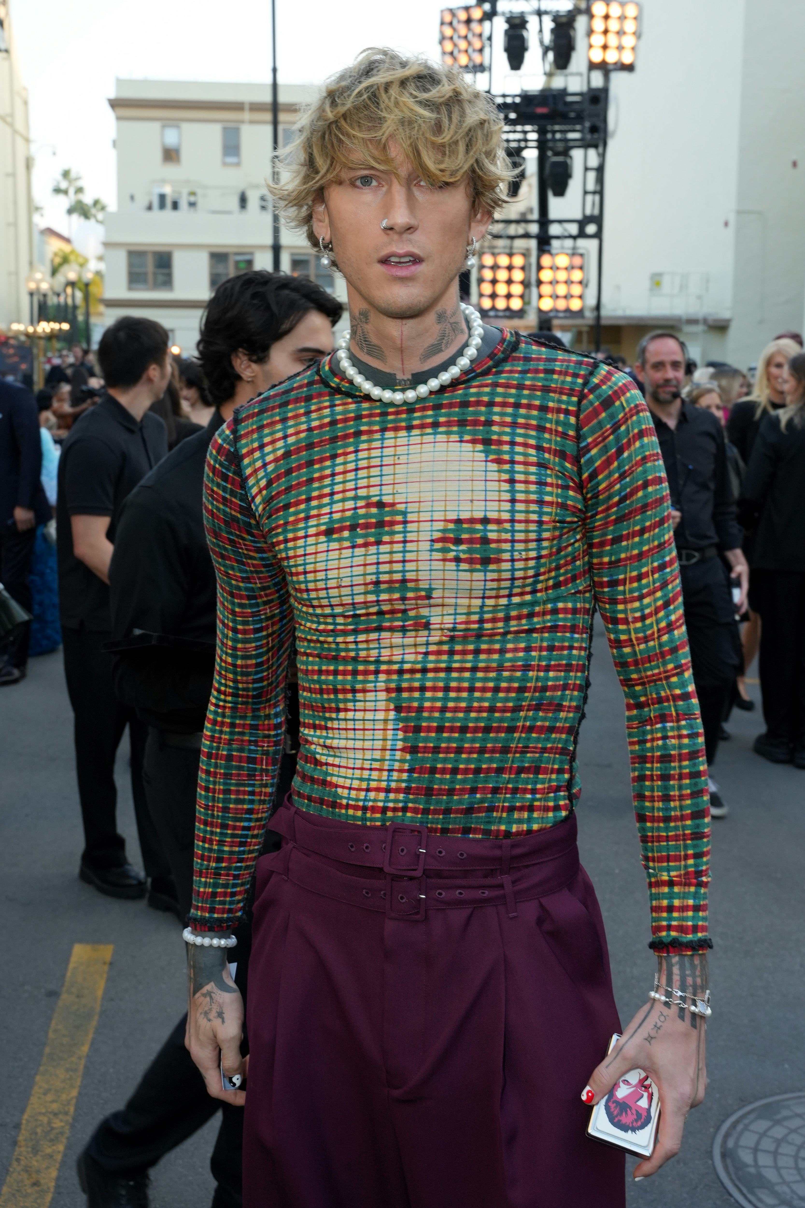 Machine Gun Kelly compares his sex life to F1 drivers.