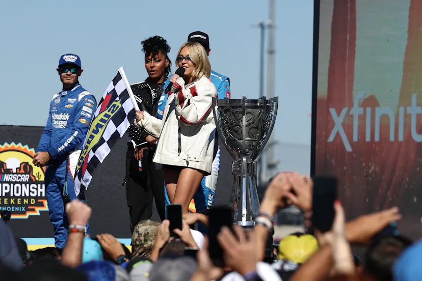 AVONDALE, ARIZONA - NOVEMBER 02: Sydney Sweeney speaks onstage during pre-race ceremonies prior to t...