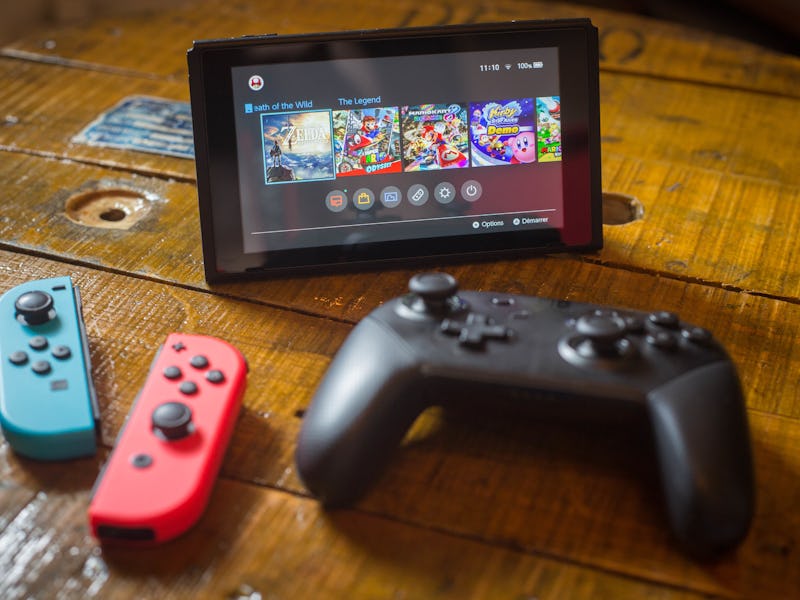 BANGKOK, THAILAND - 2018/04/27: In this photo illustration, a turned on Nintendo Switch with 2 Joy-...