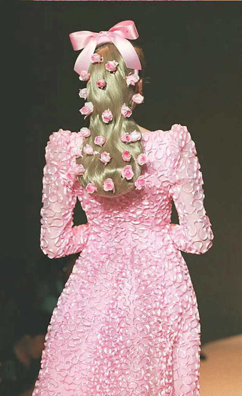 For the bride who never looks back, Hubert Givenchy embroiders pink satin ruffles on a gown of pink ...
