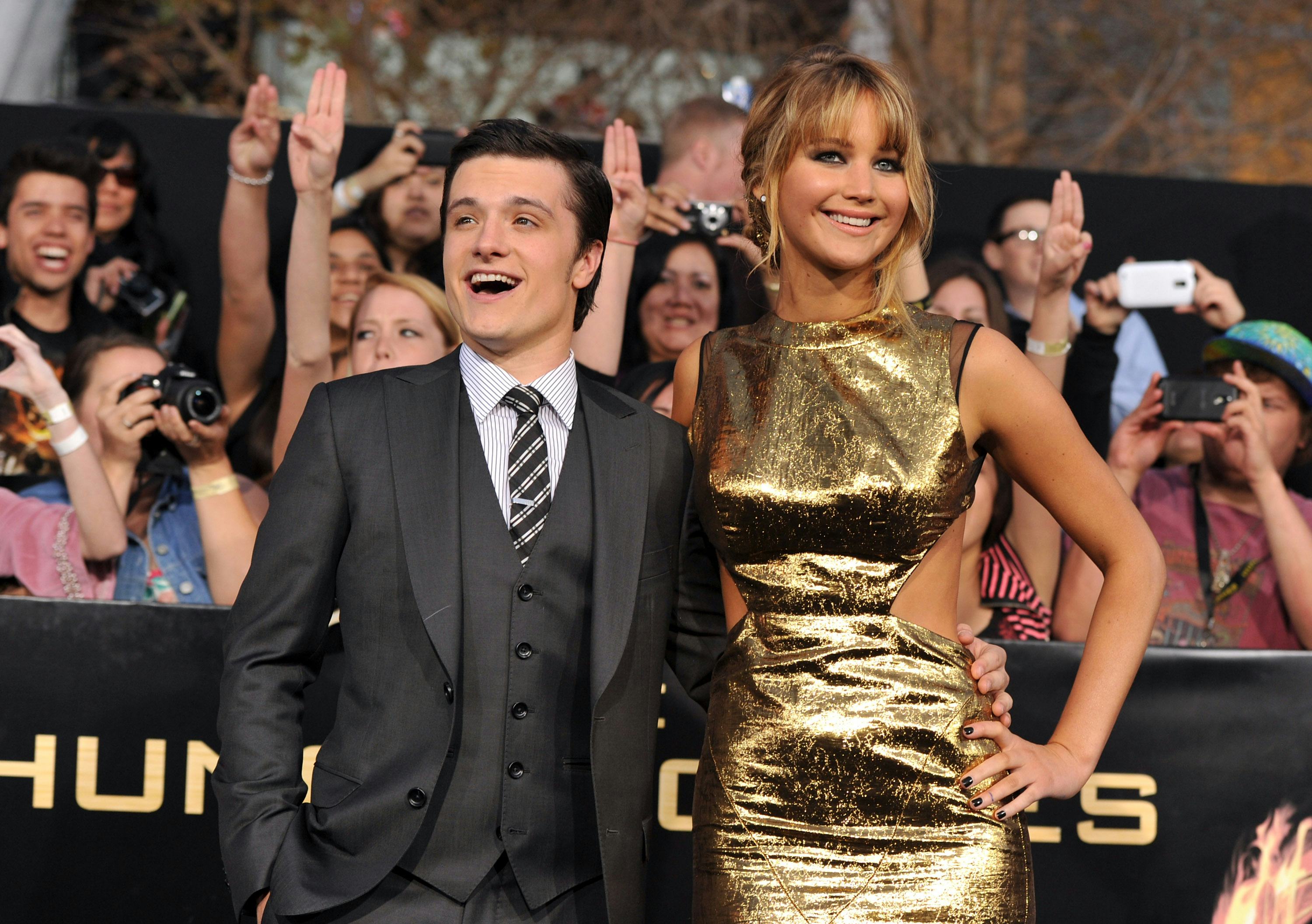 Actors Josh Hutcherson (L) and Jennifer Lawrence arrive at the premiere of Lionsgate's "The Hunger G...