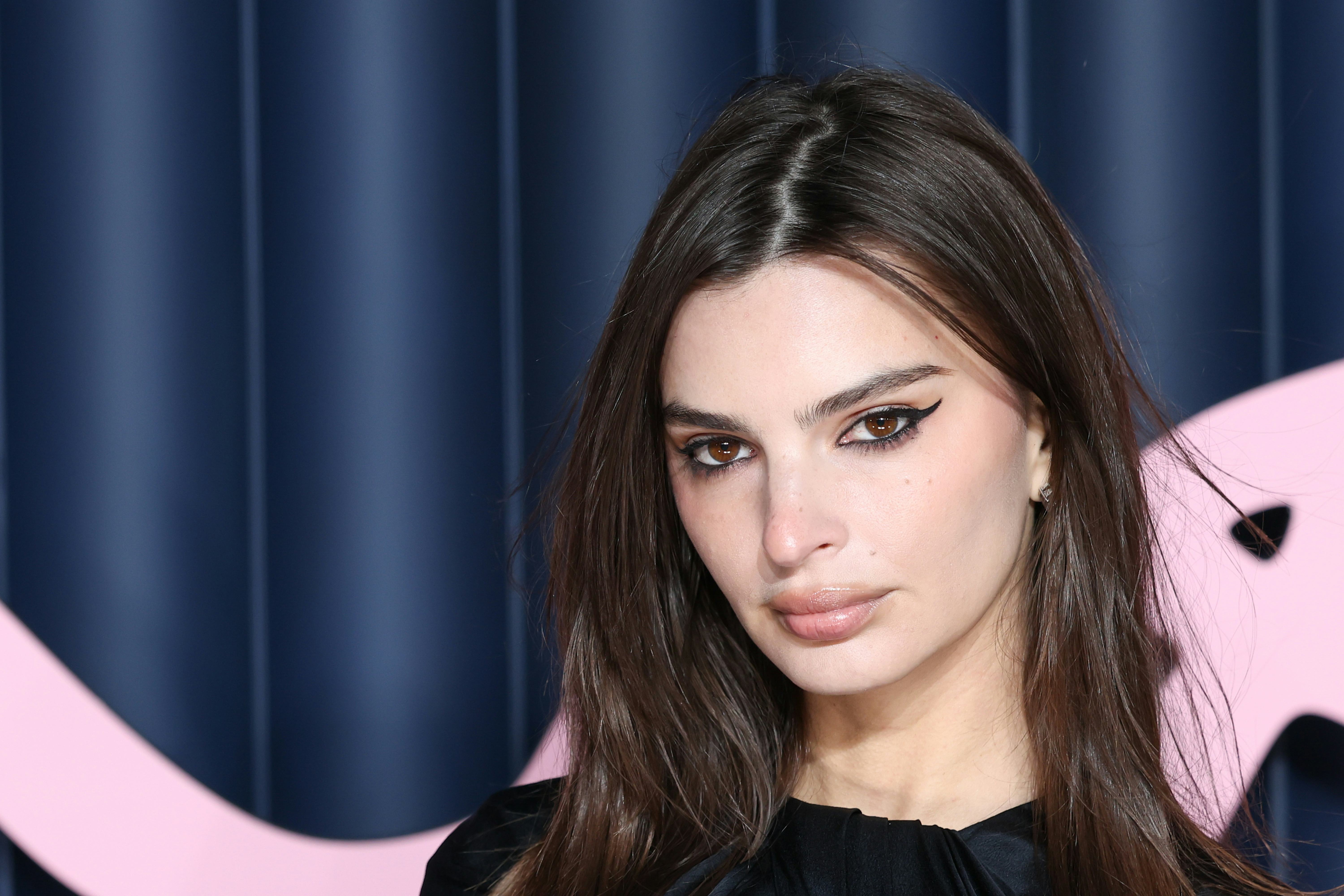 Emily Ratajkowski *Sleighed* Holiday Dressing In A Santa Red Mini