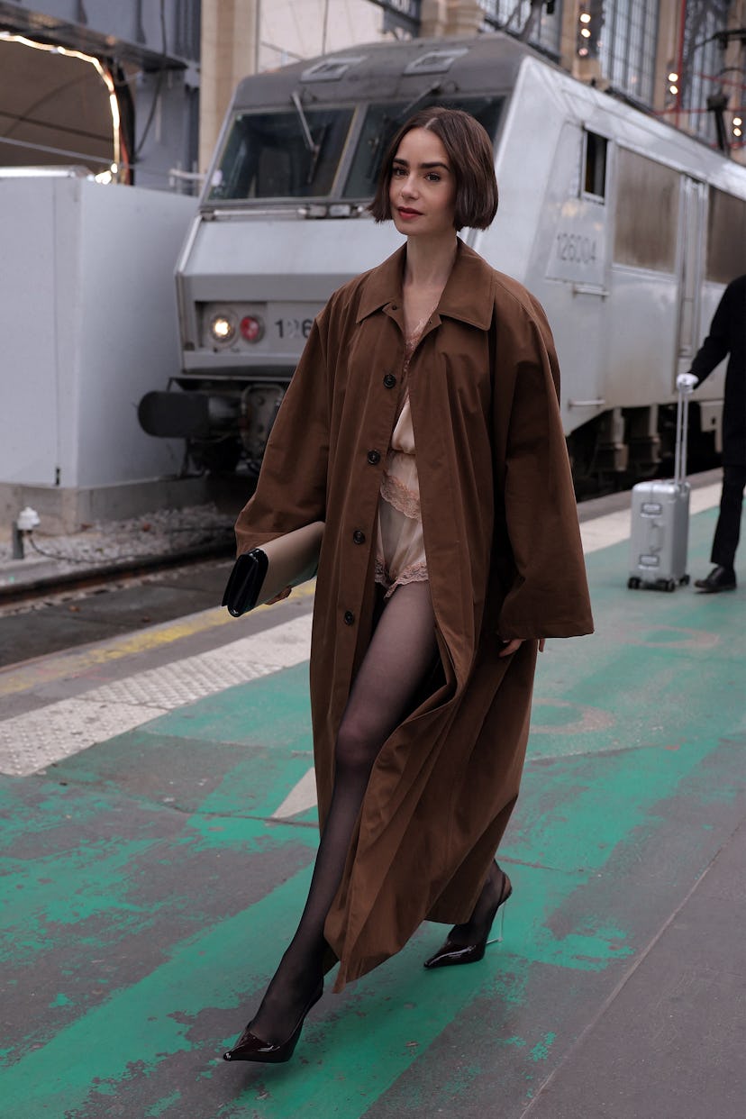 US actress Lily Collins walks on a platform after stepping out of the luxury Orient Express train to...
