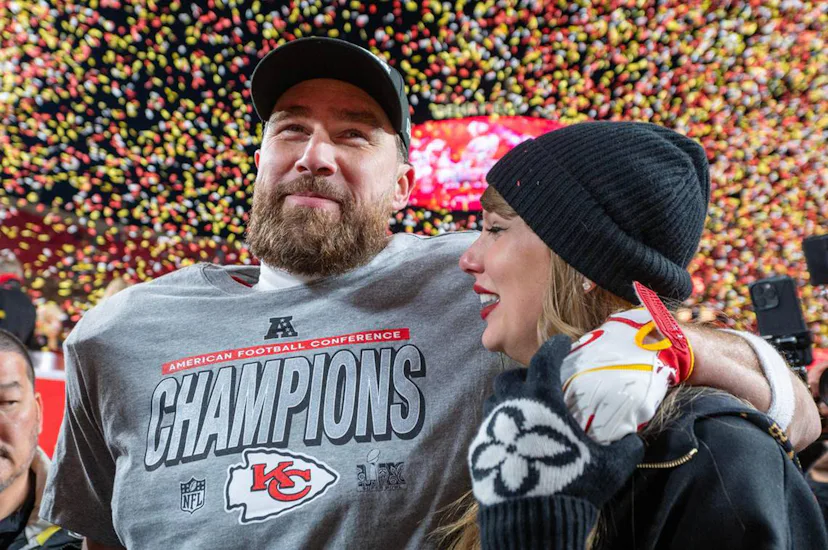 Travis Kelce and Taylor Swift walk off the field