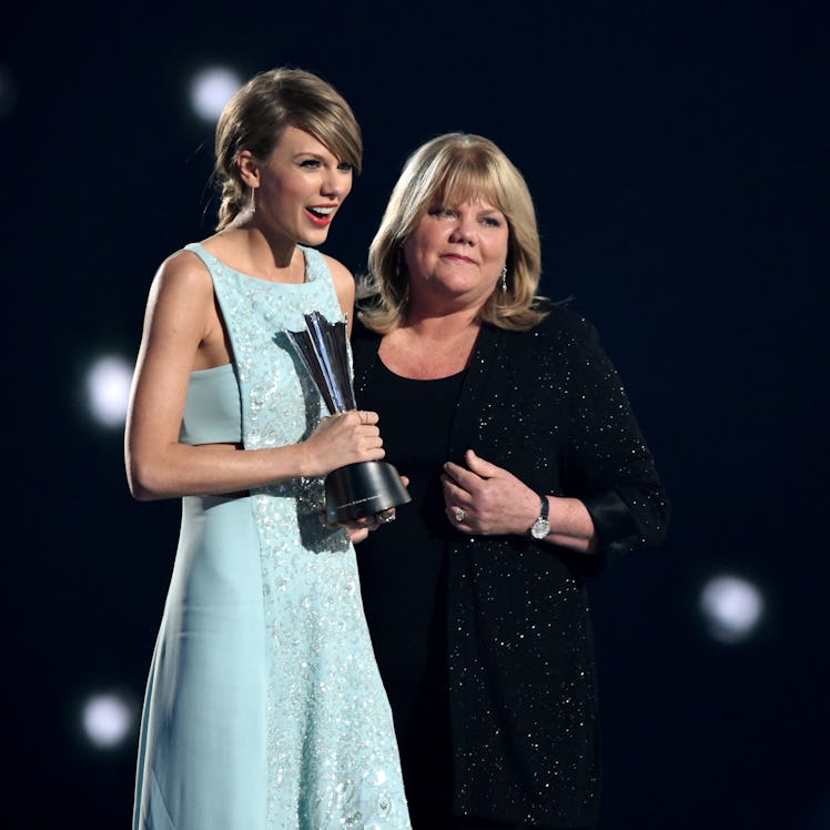 ARLINGTON, TX - APRIL 19: Honoree Taylor Swift (L) accepts the Milestone Award from Andrea Swift on...
