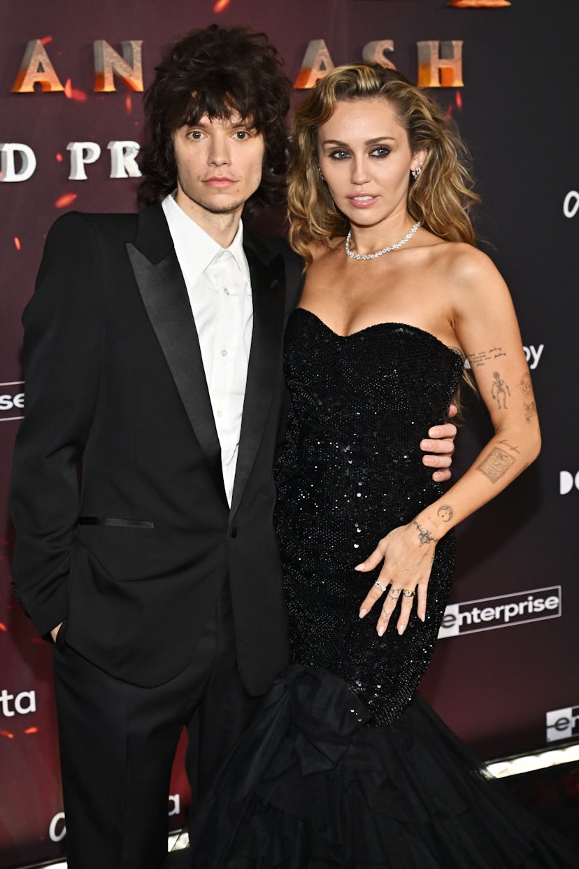 Maxx Morando and Miley Cyrus at the "Avatar: Fire and Ash" World Premiere held at the Dolby Theatre ...