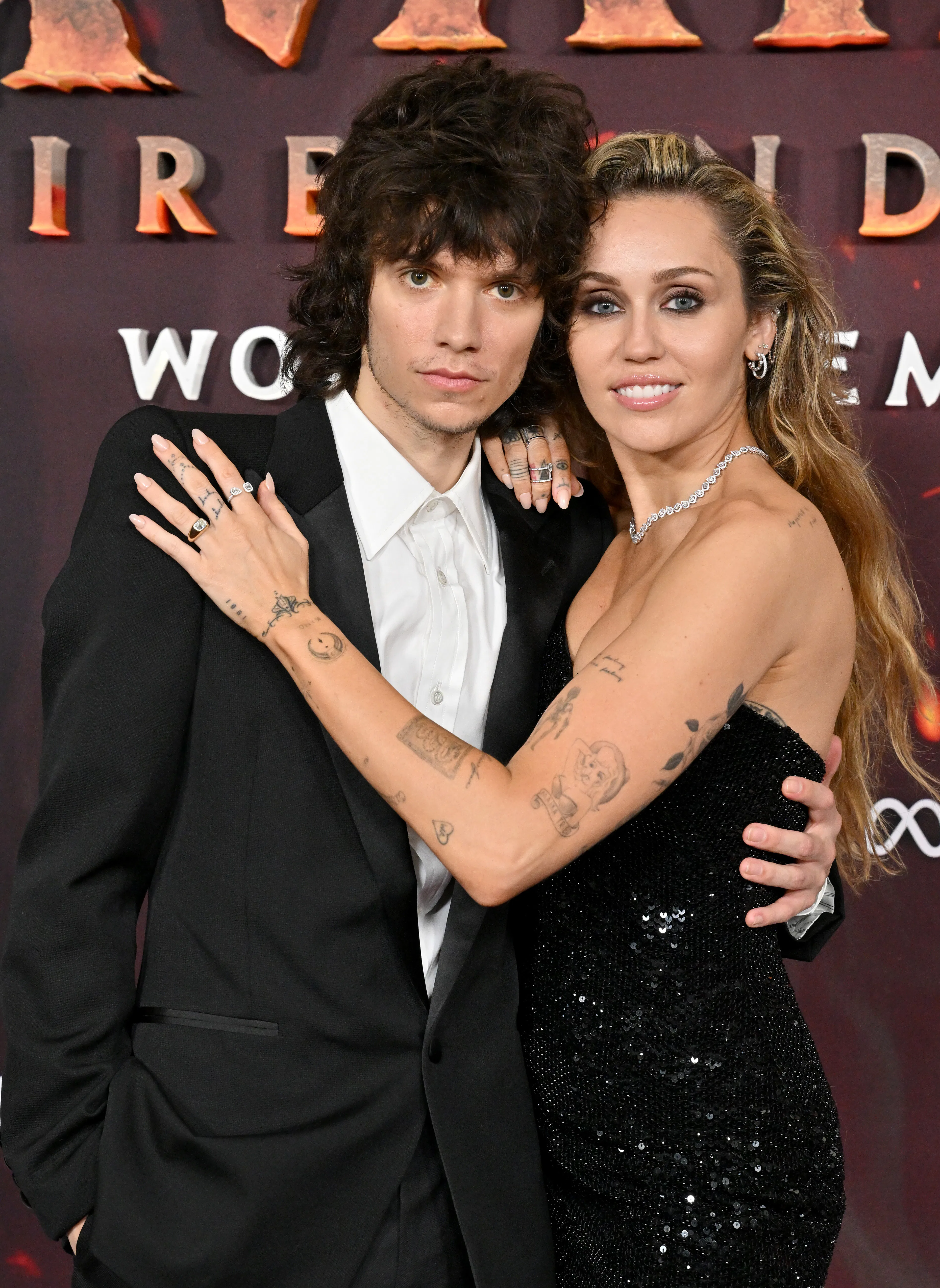 Maxx Morando and Miley Cyrus attend the Global Premiere of "Avatar: Fire and Ash"