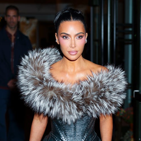 Kim Kardashian wore a sheer top to the Kardashian-Jenner family holiday party in 2015.