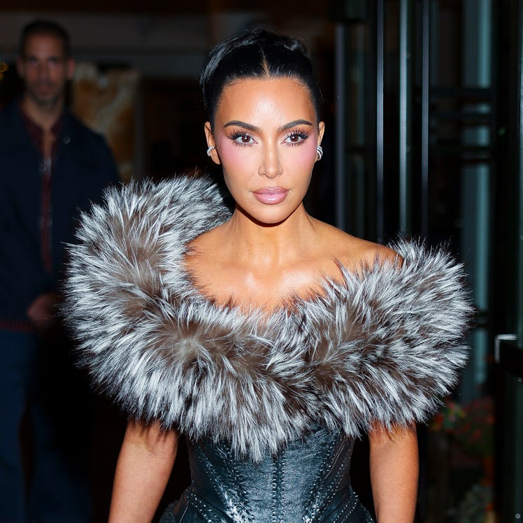 Kim Kardashian wore a sheer top to the Kardashian-Jenner family holiday party in 2015.