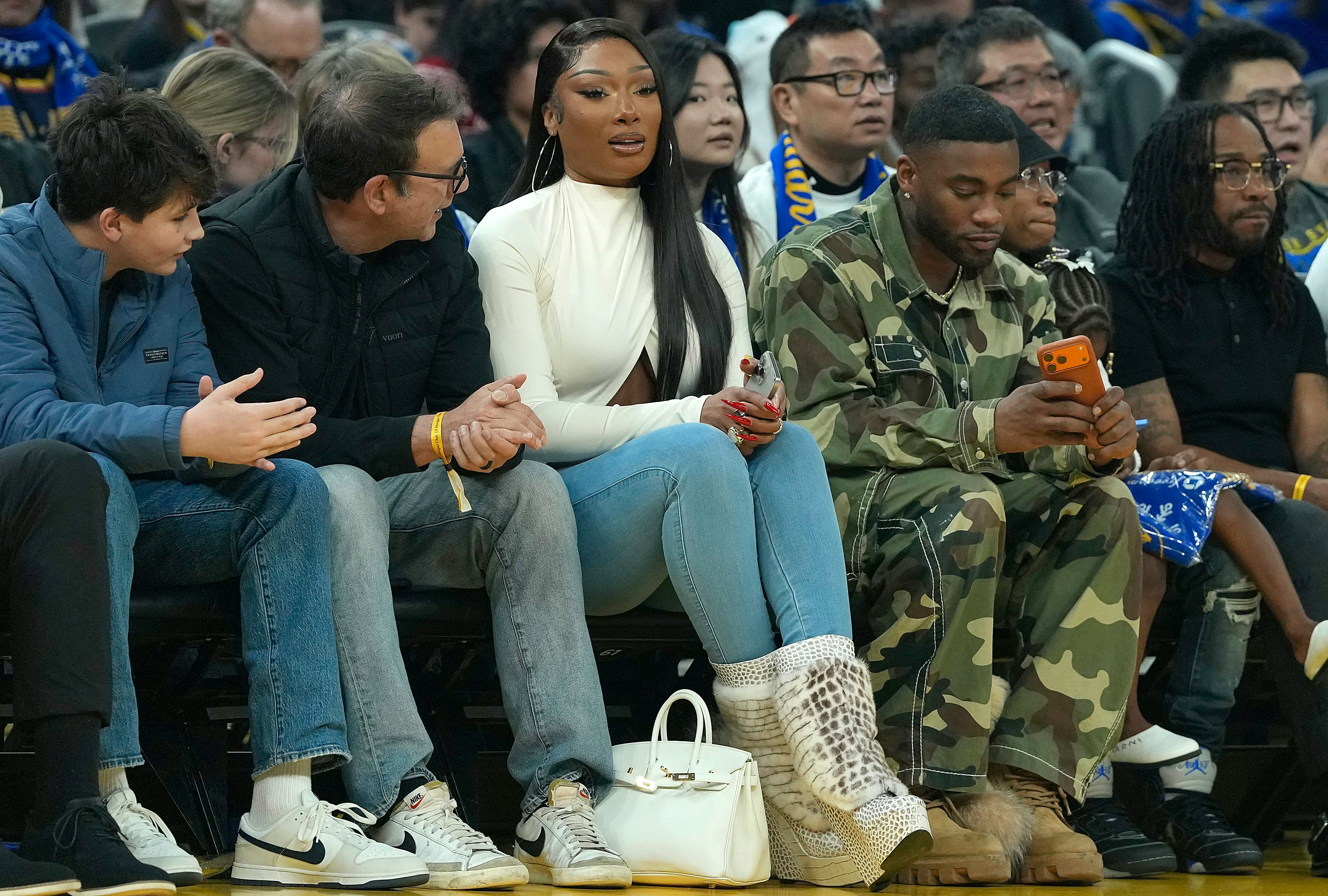 Megan Thee Stallion, American rapper and songwriter sits court side during the Dallas Mavericks and ...
