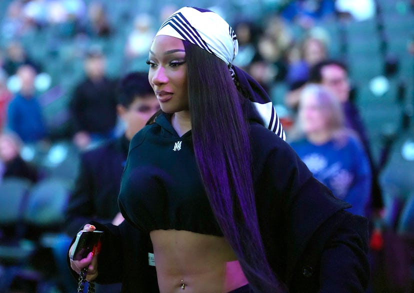 Megan Thee Stallion, American rapper and songwriter walks off the court at half time during the game...