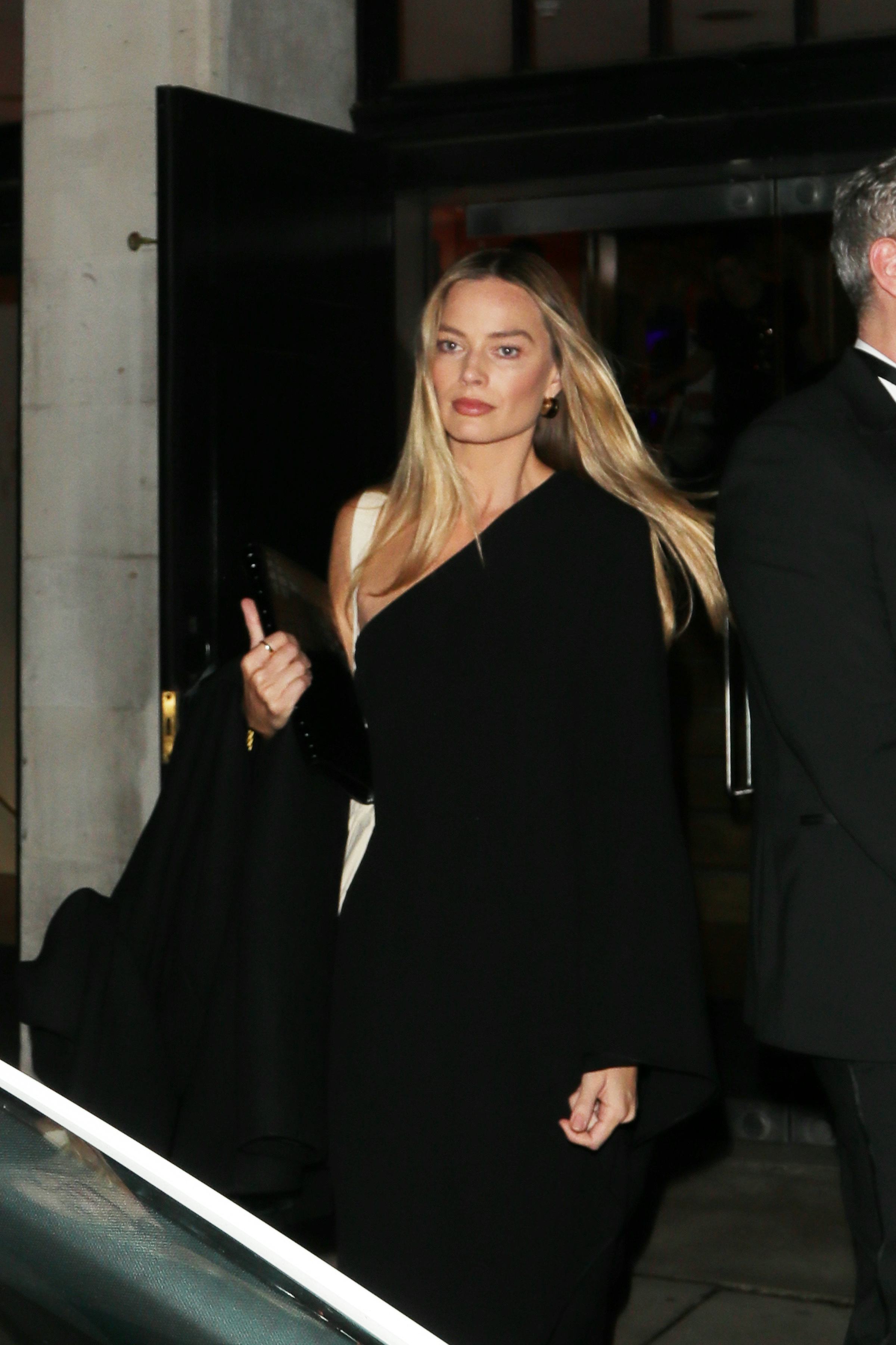 Margot Robbie seen attending War Child gala dinner on December 04, 2025 in London, England.