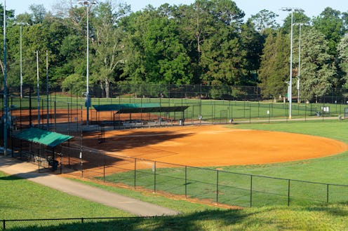 A community public park baseball field on a bright summer day
