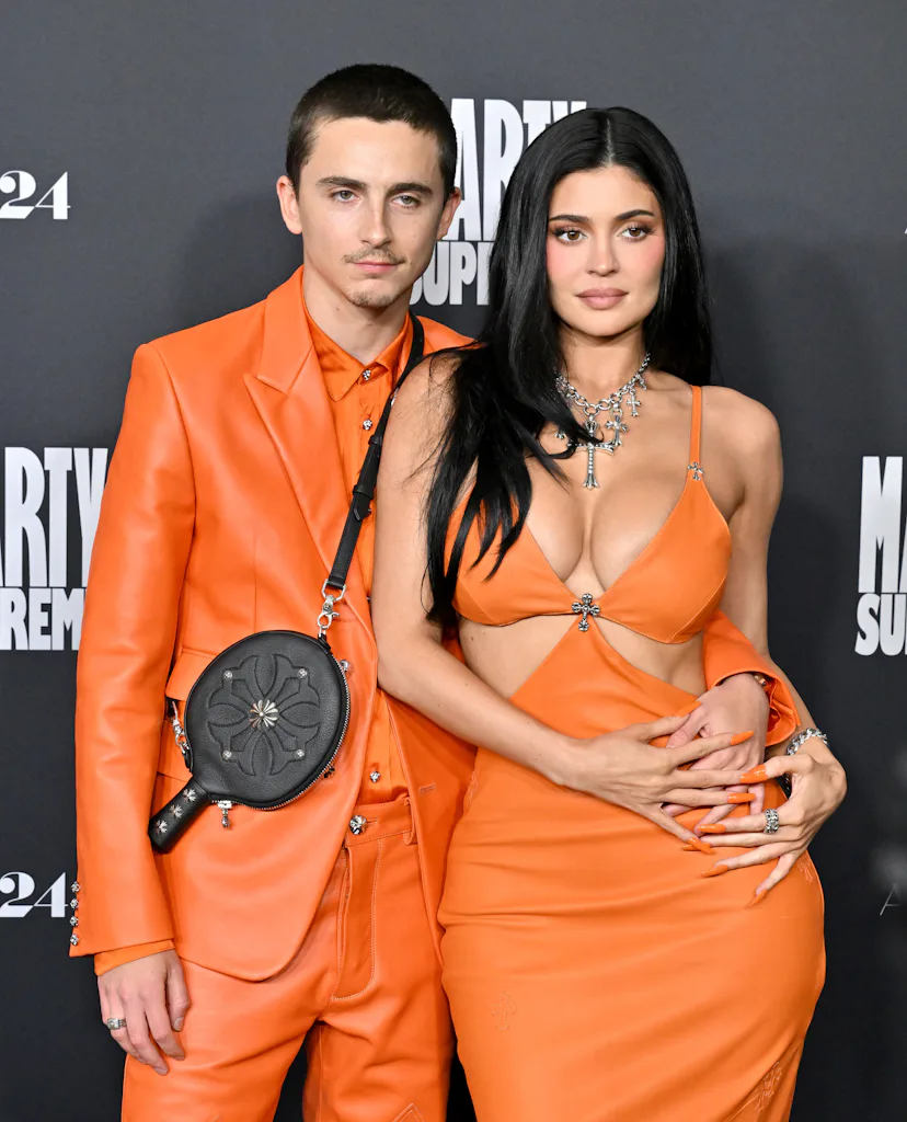 kylie jenner orange cut out dress Were Kylie Jenner and Timothe Chalamet's Matching 'Marty Supreme' Looks Style or Strategy?