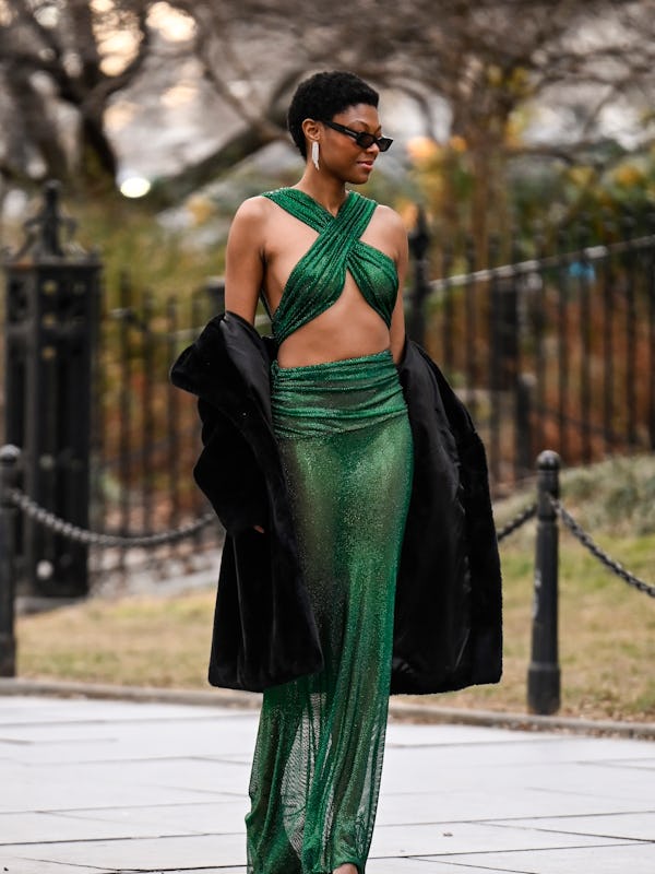 NEW YORK, NEW YORK - FEBRUARY 05: Chelsea Vaughn is seen wearing a green sheer Bronx and Banco dres…