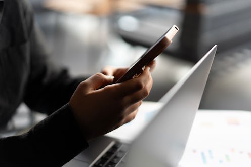 Close-up of young woman hand using smartphone