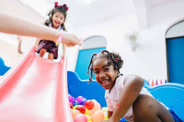 Two girls playing in a ball pit. "Mean girls" might just lack the ability to communicate because of ...