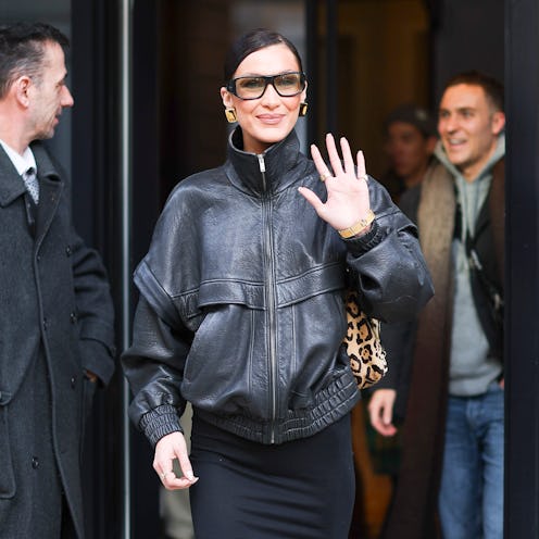 Bella Hadid biker shorts and chunky Coach sneakers