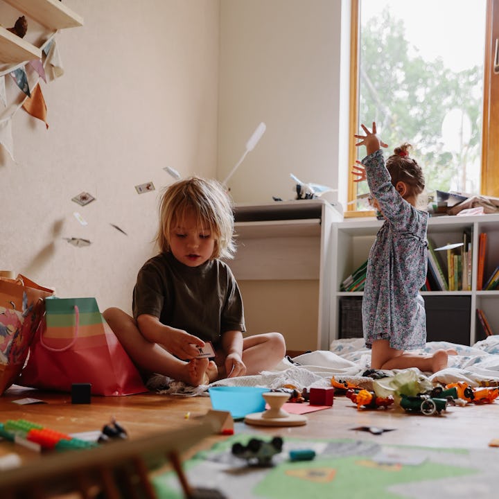 Untidy House, children are playing  in messy room.