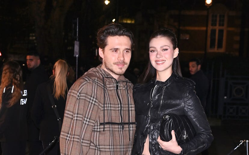 LONDON, ENGLAND - FEBRUARY 24: (L-R) Brooklyn Beckham and Nicola Peltz attend the Burberry Winter 20...