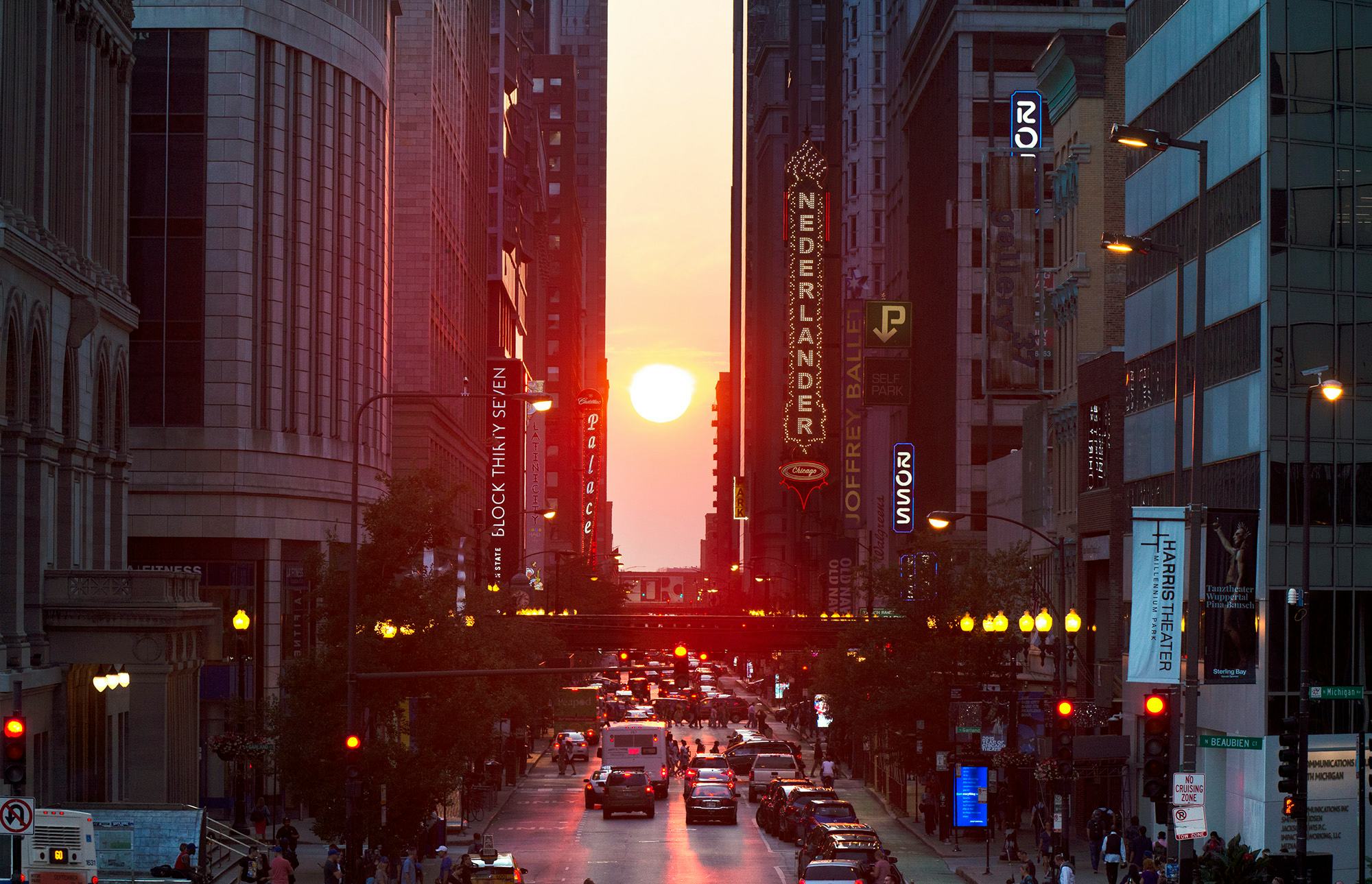 The setting sun is seen looking west on Randolph Street in Chicago on Friday, Sept. 20, 2019, just d&hellip;