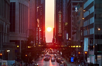 The setting sun is seen looking west on Randolph Street in Chicago on Friday, Sept. 20, 2019, just d…