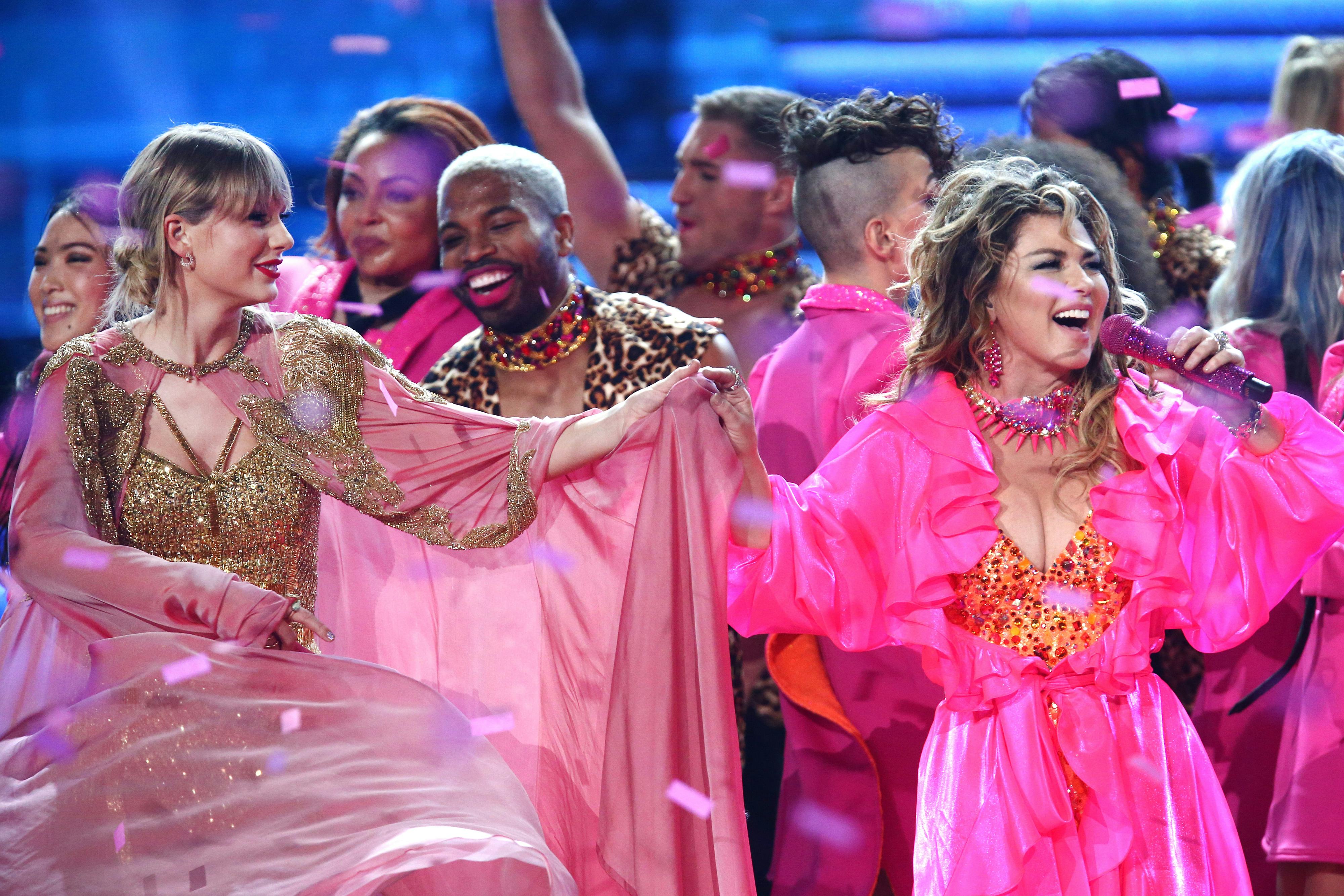 Taylor Swift and Shania Twain onstage during the 2019 American Music Awards