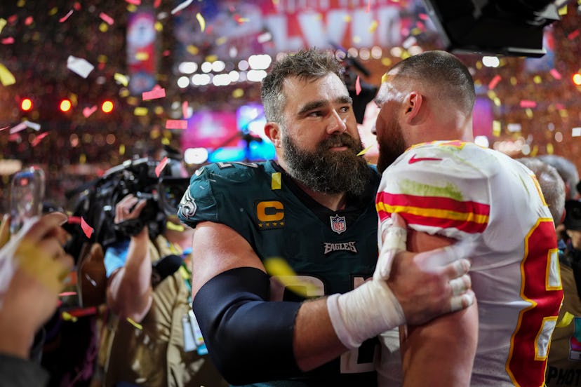 GLENDALE, AZ - FEBRUARY 12: Jason Kelce #62 of the Philadelphia Eagles speaks with Travis Kelce #87 …