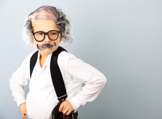 Little boy dressed as an old man.