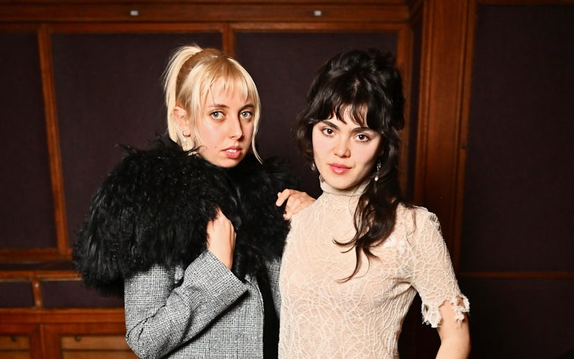 PARIS, FRANCE - MARCH 08: Georgia Davies and Abigail Morris of The Last Dinner Party attend the McQu...