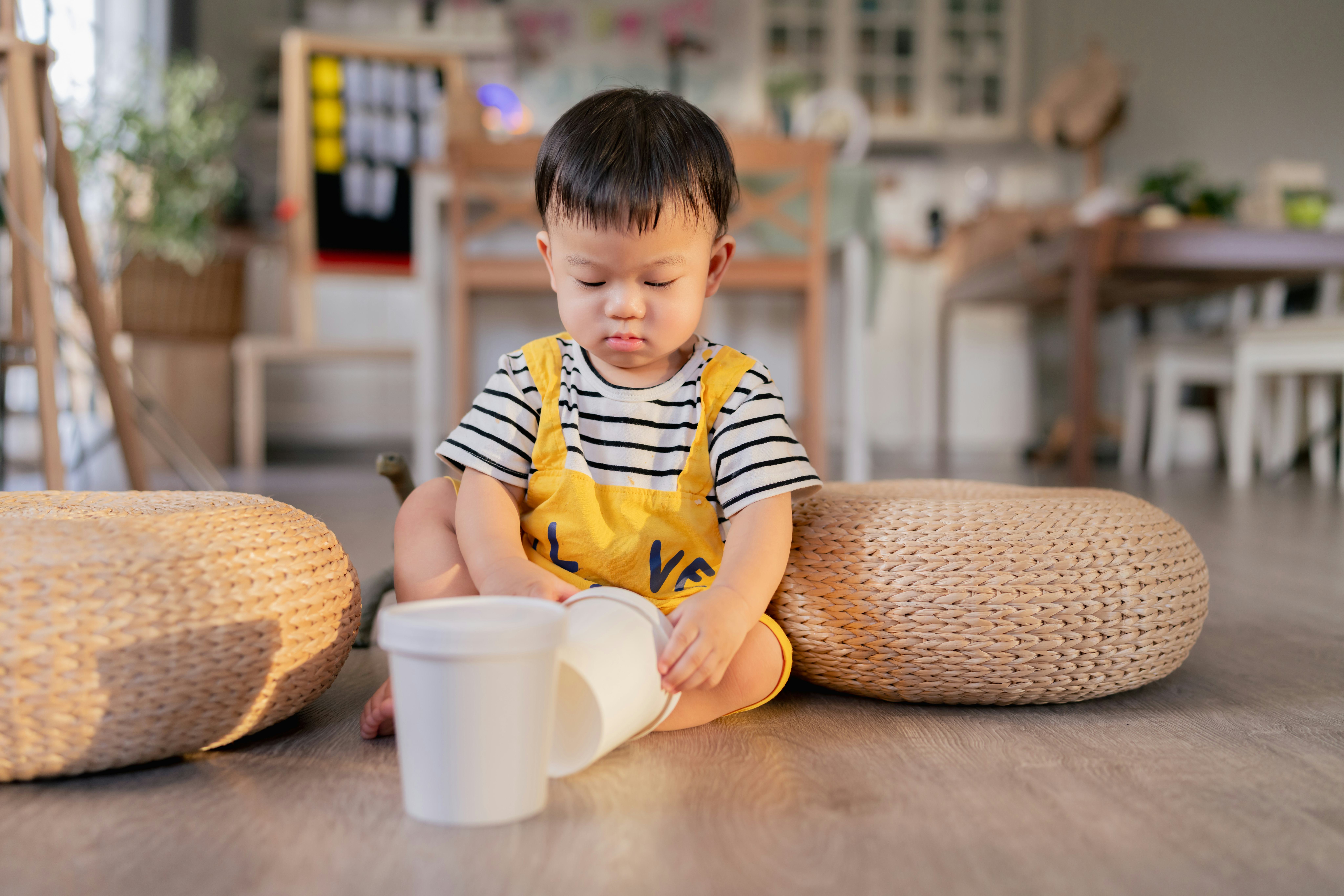 A baby boy playing with toys